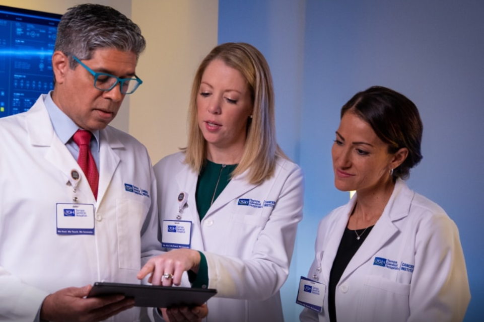 tgh in the palm beaches physicians view images on a tablet and discuss what they see